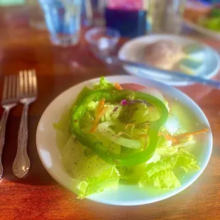 a plate of salad and a fork