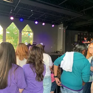 a group of people standing in a circle