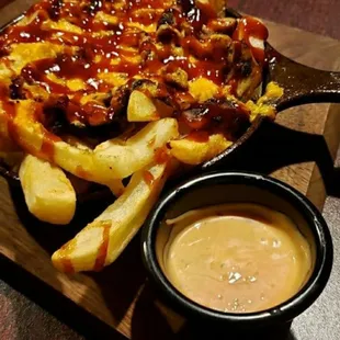 The Jerk Joint Fries are French Fries loaded with Jerk Chicken and Cheddar Cheese drizzled in Homemade Jerk Joint BBQ sauce ...ummmmmmm