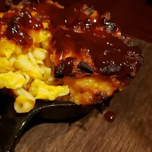 Homemade oven-baked 4 cheese Mac. Drizzled with Jerk Joint BBQ sauce ... ummmmmmm