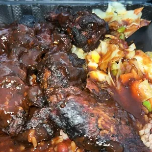 9pc Jerk Wings Meal, rice and peas and cabbage with extra jerk sauce on the side