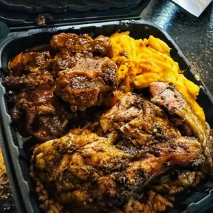 Jerk Chicken &amp; Oxtail Combo w/ Mac n' Cheese &amp; Peas n' Rice!....Double Thumbs Up!!  Seasoned and cook to perfection!