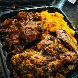 Jerk Chicken &amp; Oxtail Combo w/ Mac n' Cheese &amp; Peas n' Rice!   Soooo goood. This dish did not disappoint!