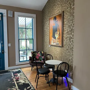 a dining room with a table and chairs