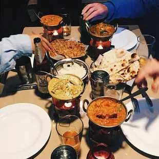 From top to bottom: Chicken Tikka Masala, Chicken Curry, Aloo Parantha, Plain Naan, Lamb Korma and Butter Chicken--THE BEST!