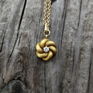 Gold Love Knot Pendant with Diamond Center