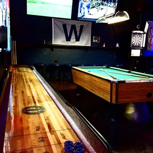 a shuffler table and a pool table