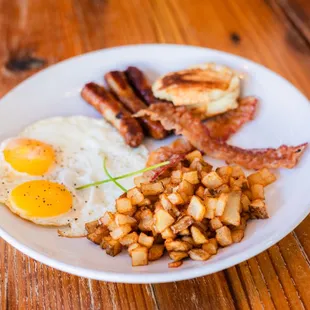 Sausage, bacon, 2 eggs your way, w/ home fries &amp; biscuit