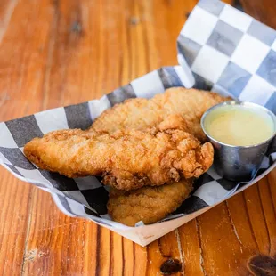 Fresh hand breaded deep fried chicken tenders, served w/ choice of sauce