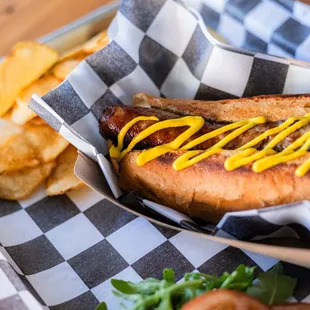 Juicy bratwurst, grilled, served on a toasted artisan roll, topped w/ mustard