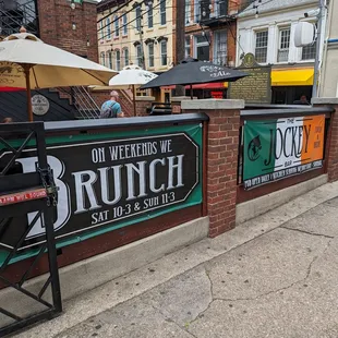Street view of the patio seating and banners