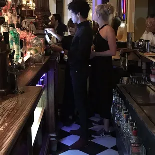 a group of people at the bar