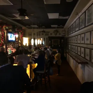 people sitting at tables in a restaurant