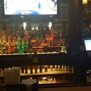 a bar with a large television