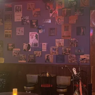 a bar with a table, chairs, and a bicycle