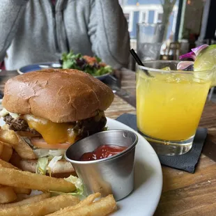 a burger and fries on a plate