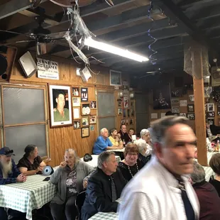a crowd of people sitting at tables