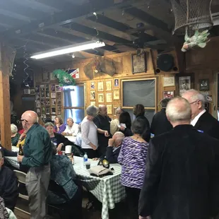 a large group of people sitting at tables