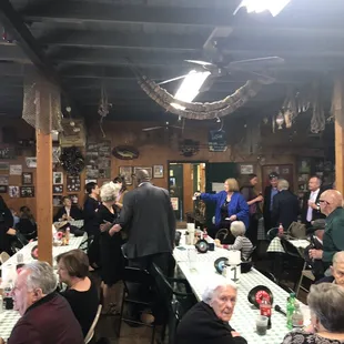 a large group of people sitting at tables