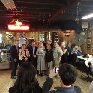 a group of people standing in a room