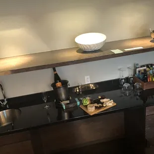 Bar area. Complementary drink and chocolates. charcuterie board made by me.