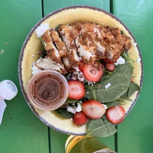 Strawberry salad with chicken added.