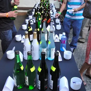 one of the many many tables lined with sake