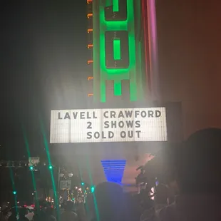 a crowd of people standing in front of it