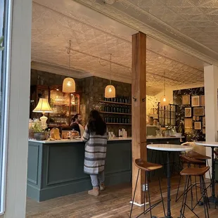 a woman standing at the counter