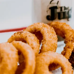 a plate of onion rings and a cup of coffee