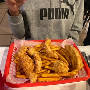 Chicken tenders and fries wondering right here. Oh I see that's good.