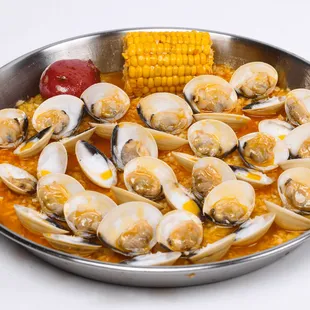 a bowl of clams and corn