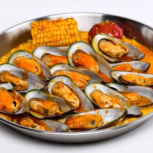 a bowl of seafood and corn