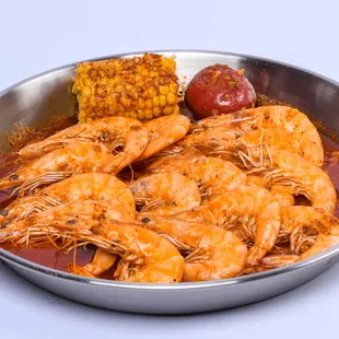 a bowl of shrimp and corn