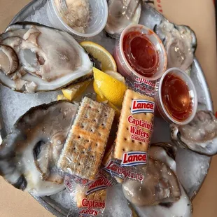 a platter of oysters and crackers