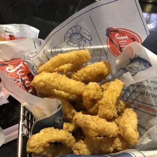 a basket of deep fried chicken nuggies