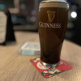 a pint of guinness on a table