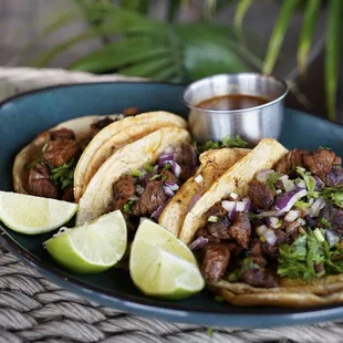 Skirt Steak Street Tacos -Three corn tortillas with tender arrachera, topped with cilantro &amp; onions