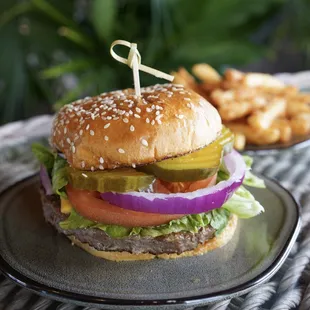 Angus Burger - An angus patty layered with lettuce, pickles, tomato, red onion, american cheese &amp; mayonnaise, served with french fries.