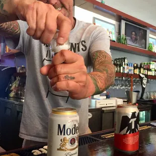 a man pouring a drink