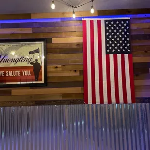 a large american flag on the wall