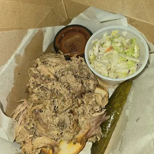 Pulled pork with coleslaw. Meat was flavorful and tender. Coleslaw was just right. I ate my entire meal and wanted more!