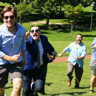 a group of men running in a park