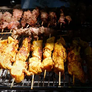 In the process of grilling Grass Fed halal lamb and chicken  kebabs