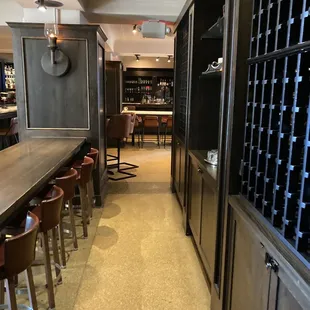 a long narrow bar with stools