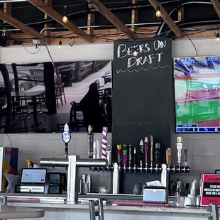 a bar with a chalkboard