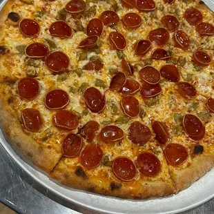 a pepperoni pizza on a plate