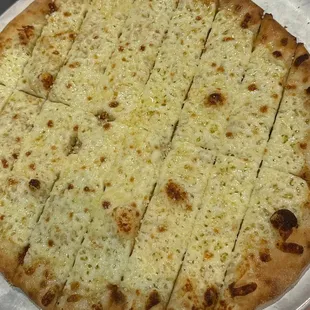 a cheesy pizza on a pan