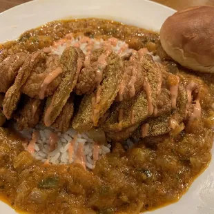 Fried Green Tomato and Shrimp Stack served on rice with Cajun vegetables
