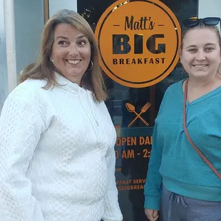 two women standing outside